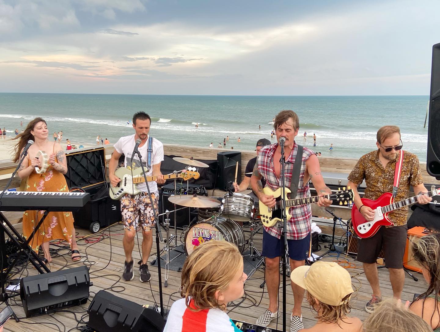 Your next favorite local band Kicking Bird playing at Ocean Grill and Tiki Bar, outside, beach in the background