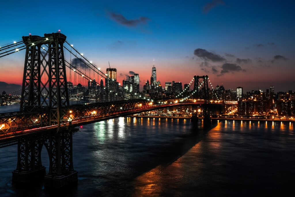 Manhattan skyline and bridge, sunset