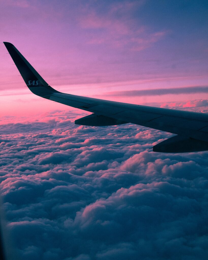 sunset over the clouds, airplane wing day trips from Wilmington, NC