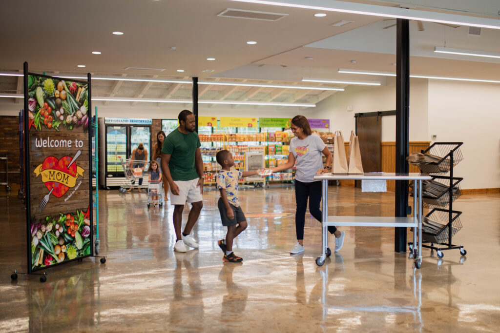 family shopping at a free food market