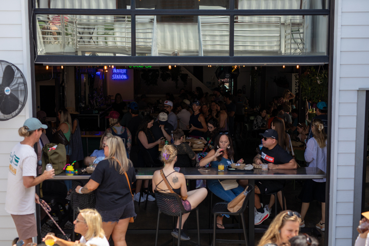 People gathered on a local business patio in the Cargo District in downtown Wilmington