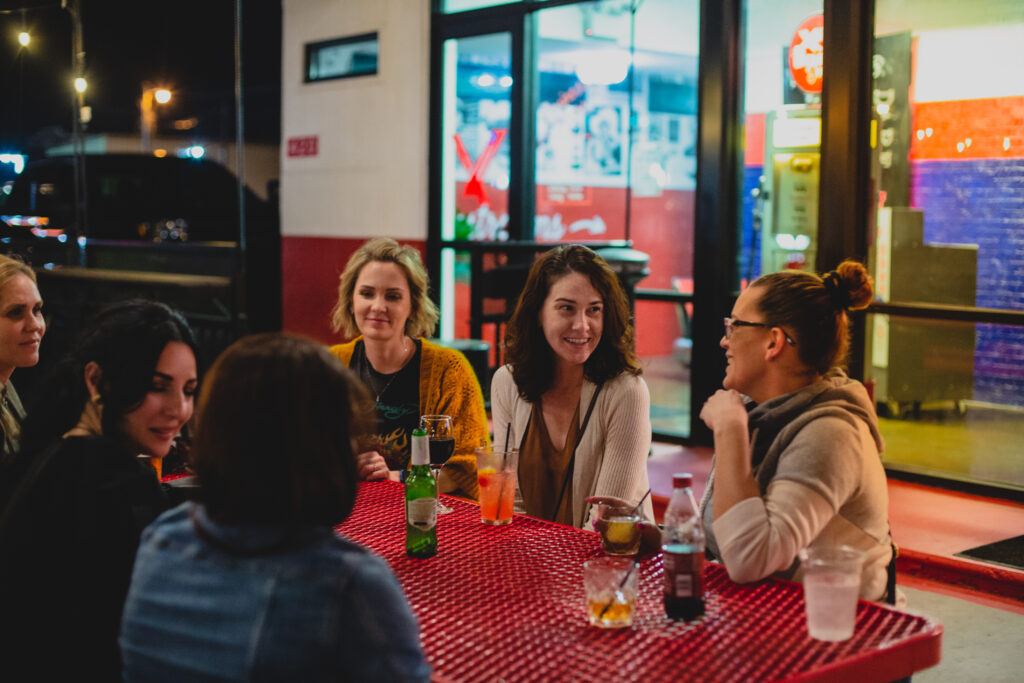 Group of people sitting at The Eagle's Dare