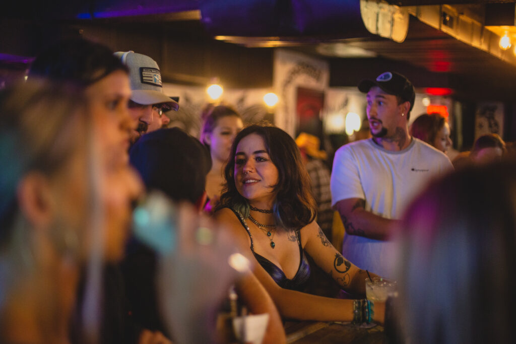 A group of guests at the bar at The Pour House