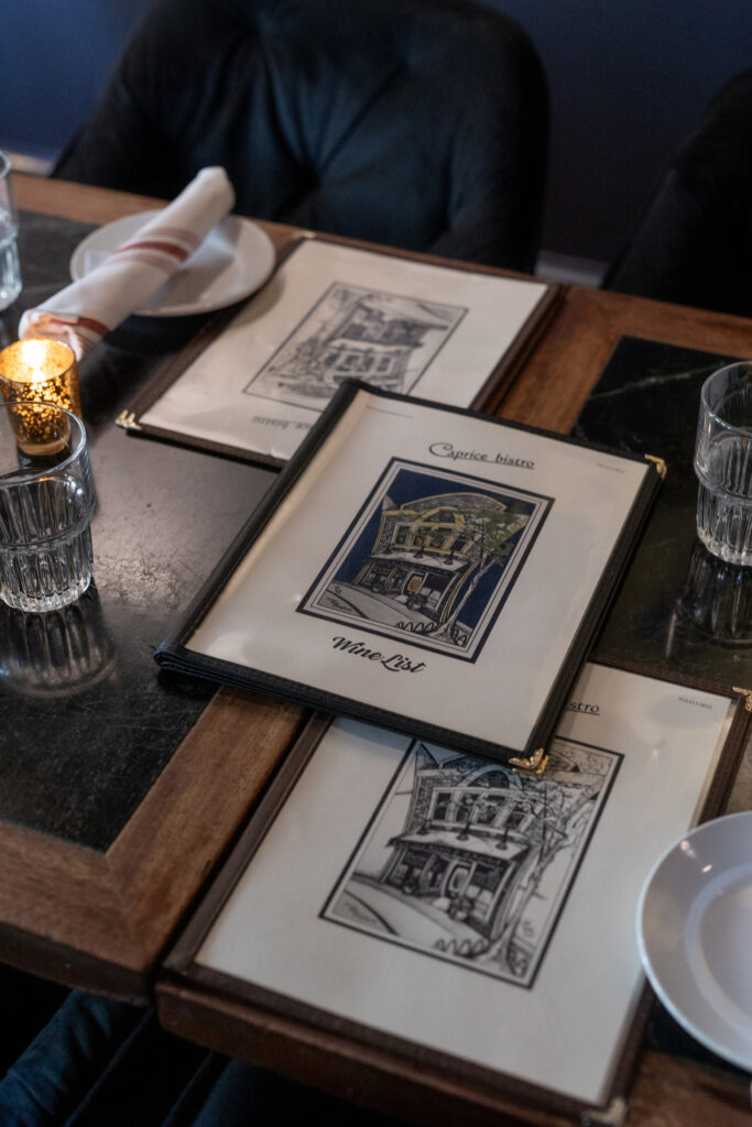 Menus stacked on a table at Caprice in Wilmington, NC