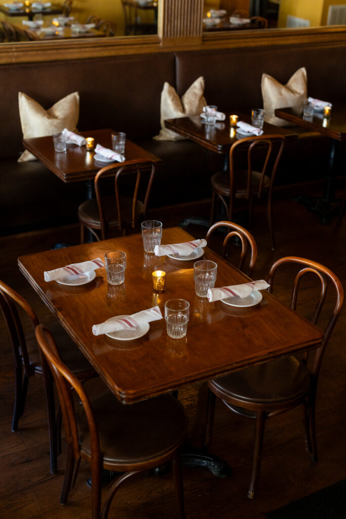 A wooden table at Caprice in Wilmington, NC